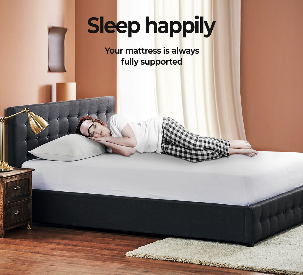 A lady sleeping on Levede Gas Lift Fabric Bed