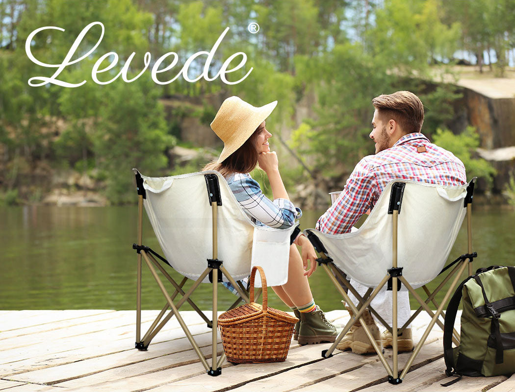 Couple sitting on Levede Moon Chairs