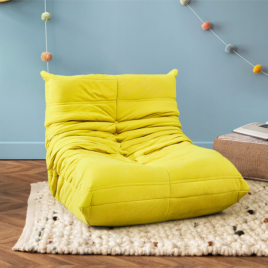 Yellow kids foam floor chair in playroom