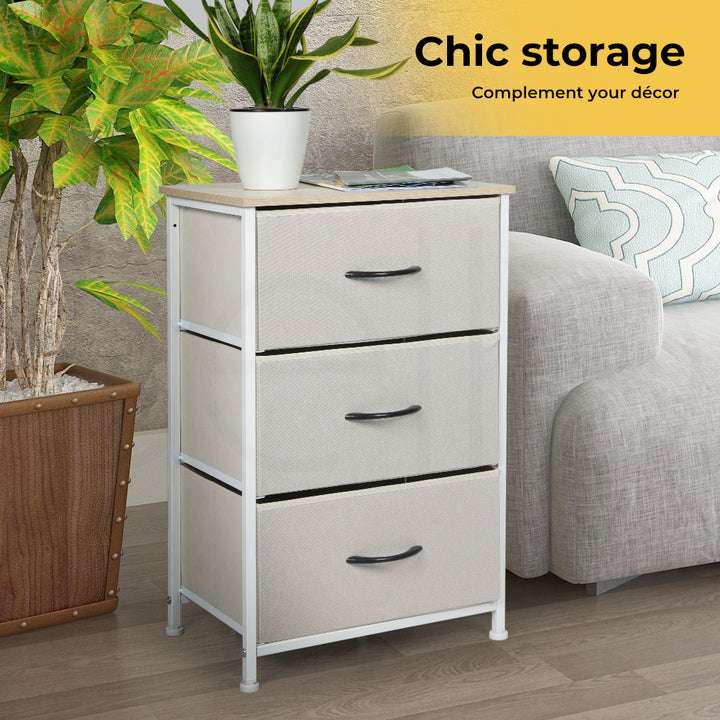 Narrow 3 Chest of Drawers Tower next to safa