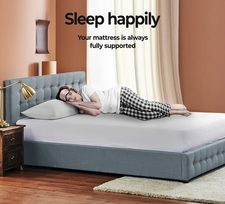 lady resting on Queen Fabric Bed Frame With Gas Lift Storage 